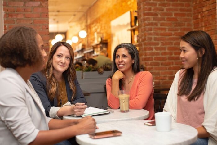 Four businesswomen having successful communication